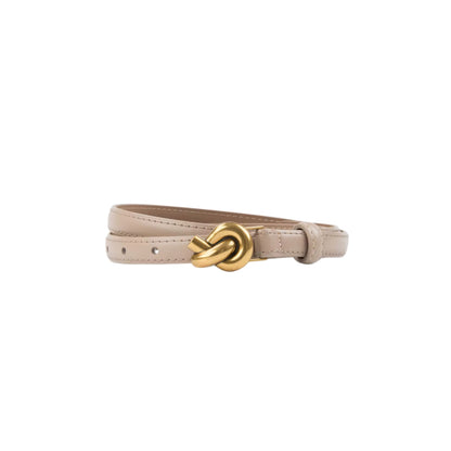 Beige belt with a gold knot buckle on a white background