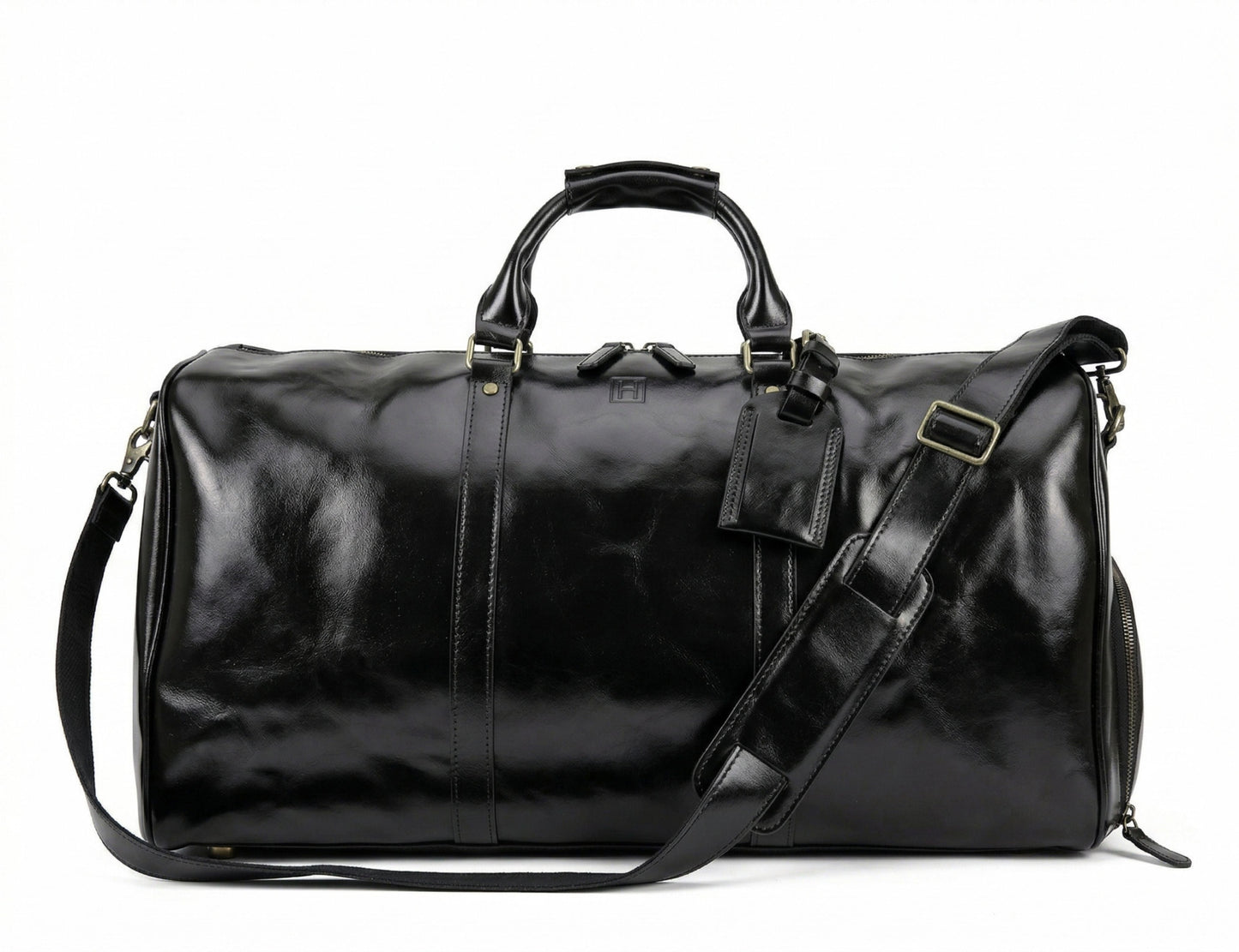 Black leather duffel bag with shoulder strap on a white background
