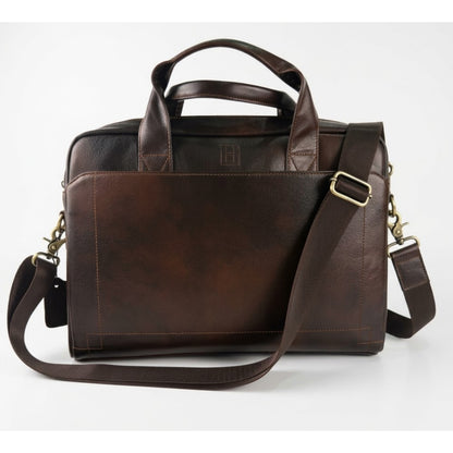 Brown leather briefcase with shoulder strap on a white background