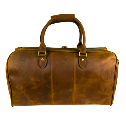 Brown leather duffel bag on a white background