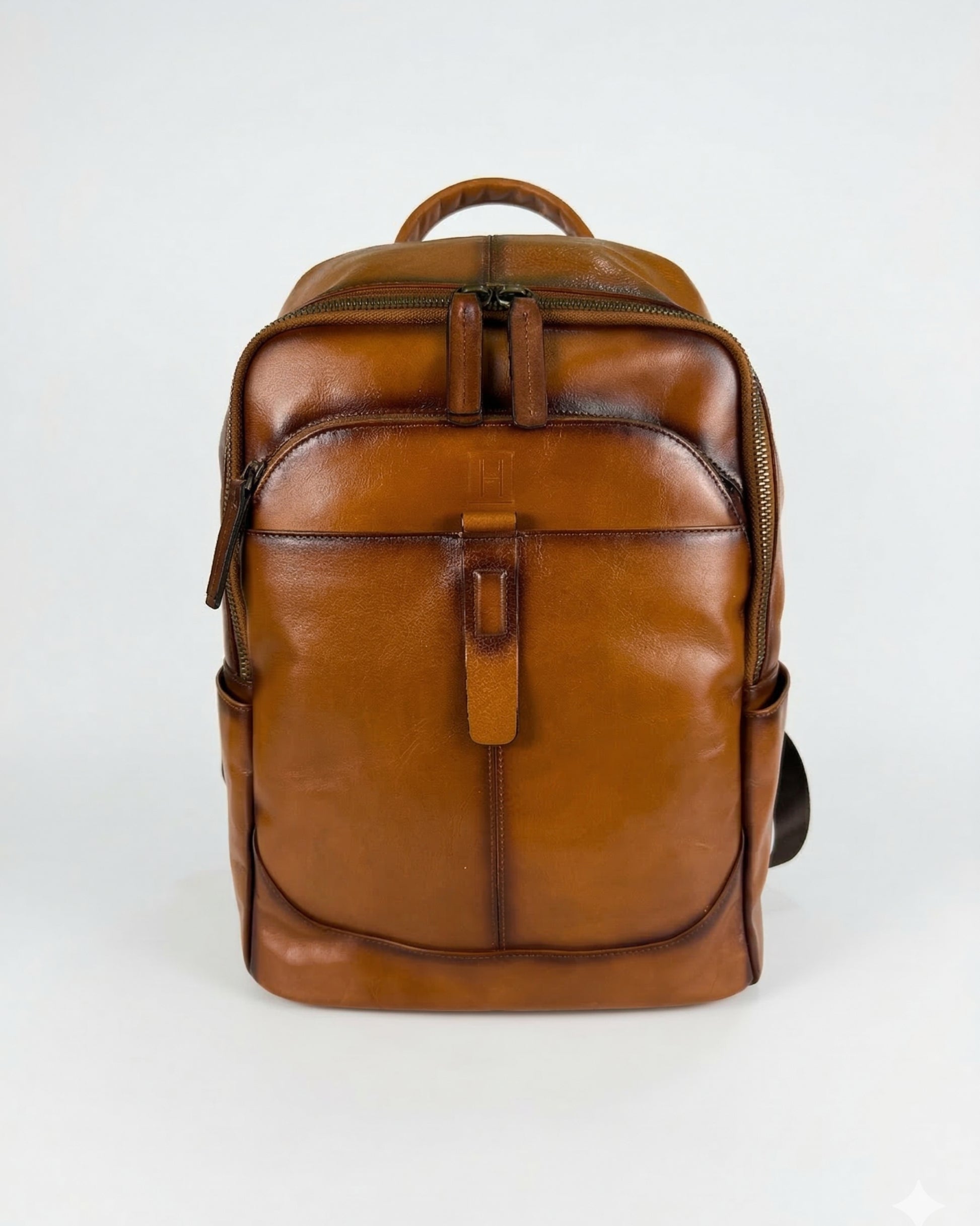 Brown leather backpack on a white background