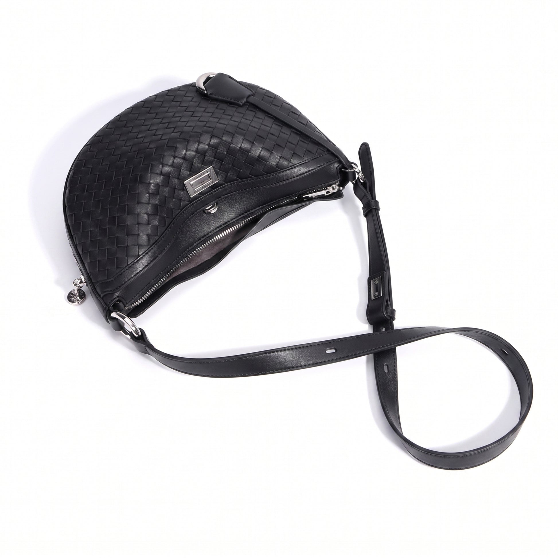 Black woven leather handbag with a strap on a white background