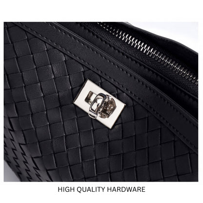 Black woven handbag with high-quality hardware on a white background