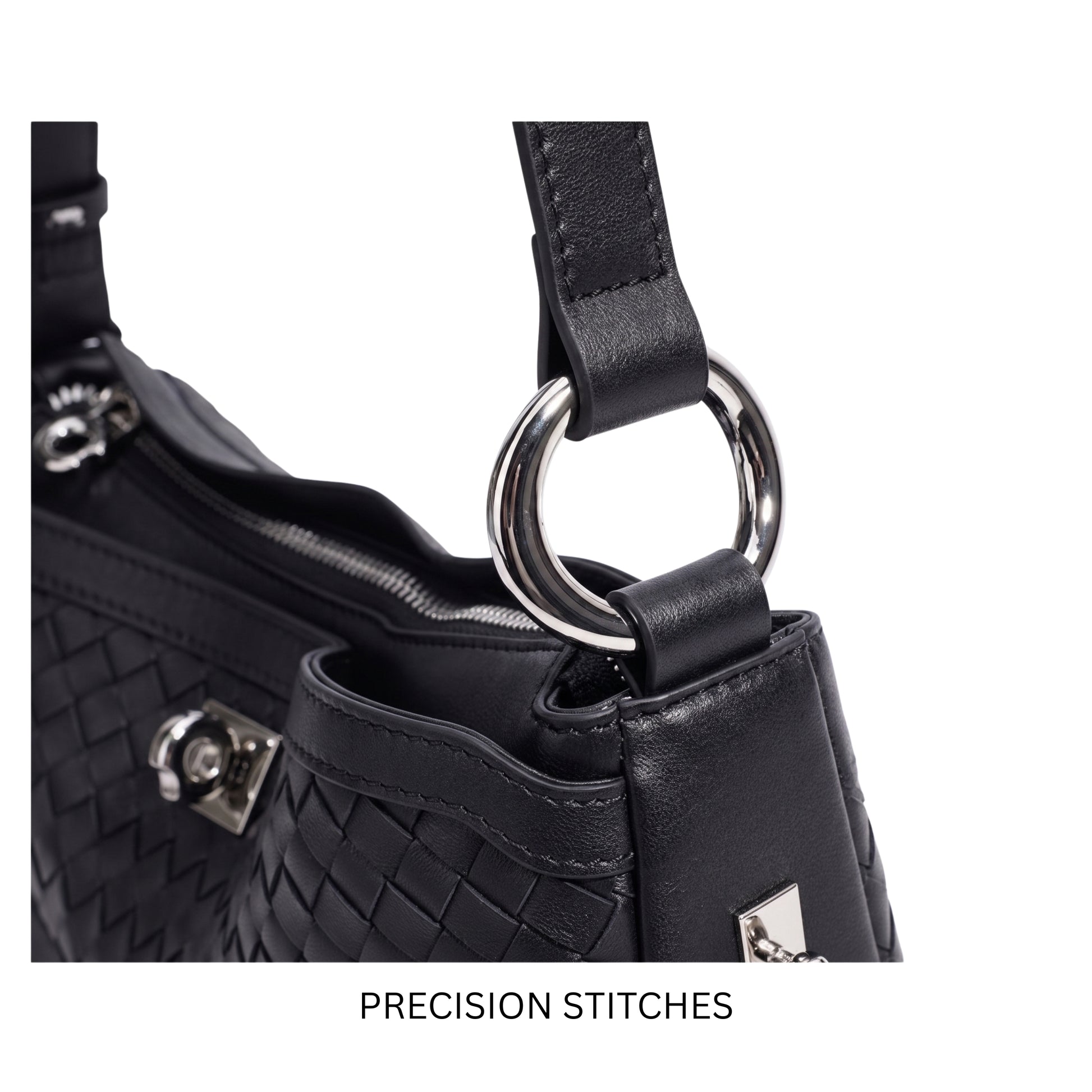 Close-up of a black handbag with precision stitching and a silver ring handle on a white background.