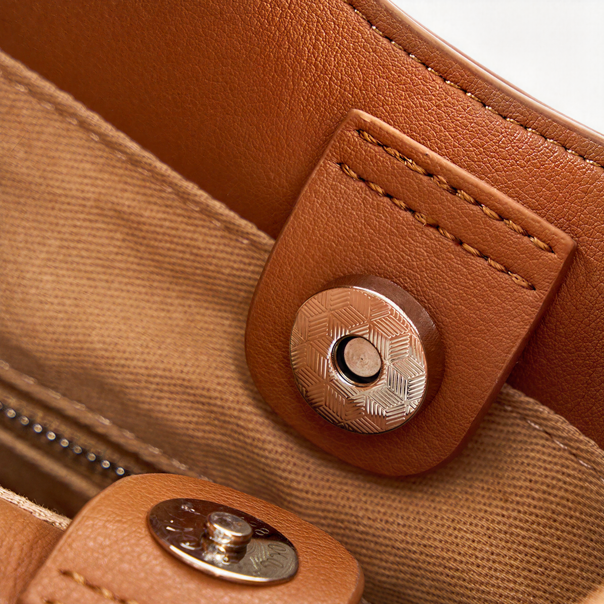 Close-up of The Luna's magnetic snap closure in Brown