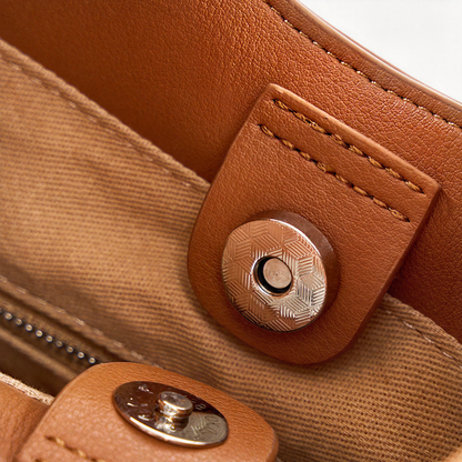 Close-up of The Luna's magnetic snap closure in Brown