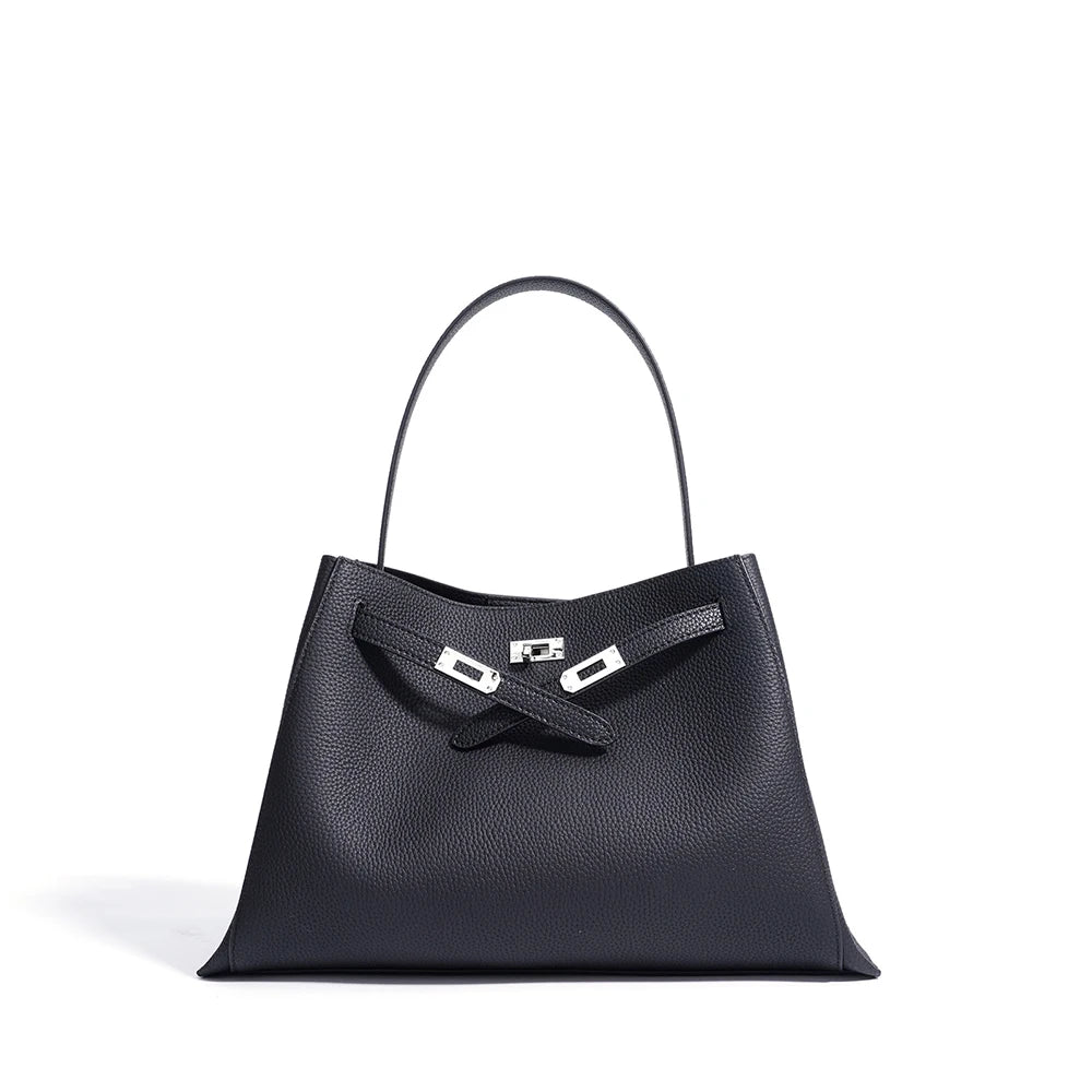 Black handbag with a silver clasp on a white background