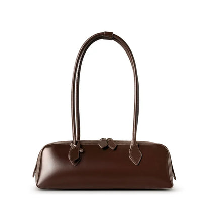 Brown handbag with a bow detail on a white background