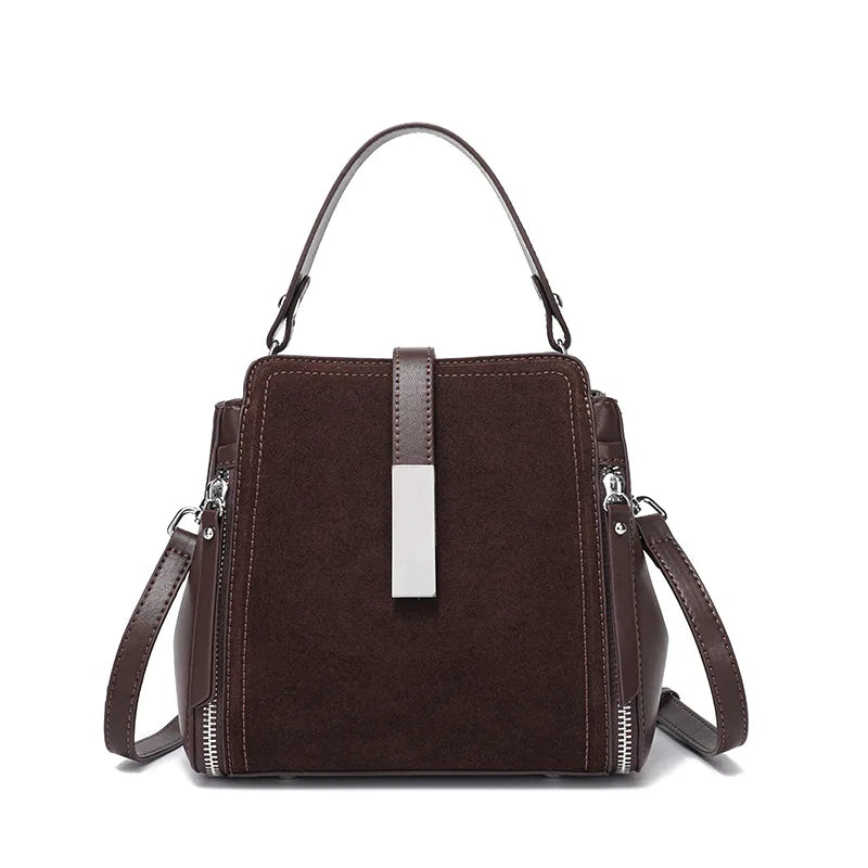Brown handbag with a silver accent on a white background