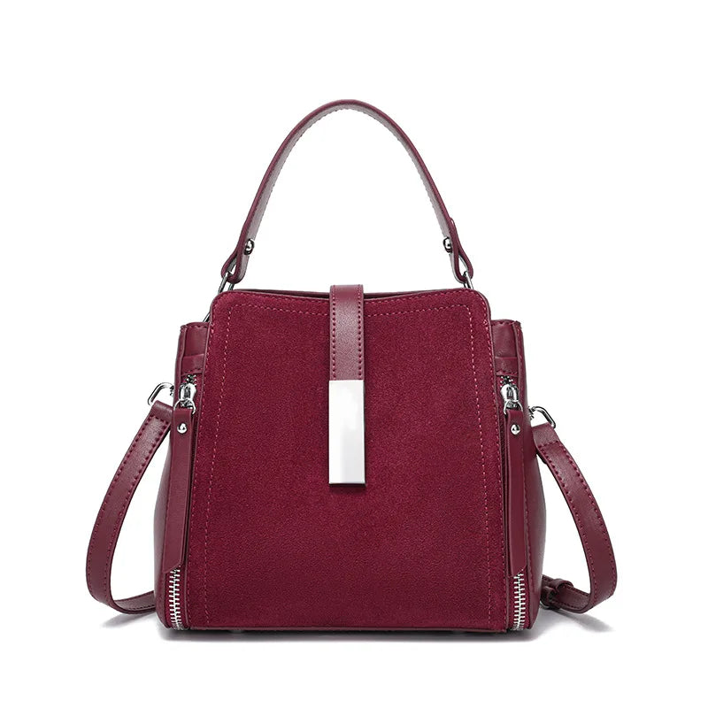 Red handbag with a shoulder strap on a white background